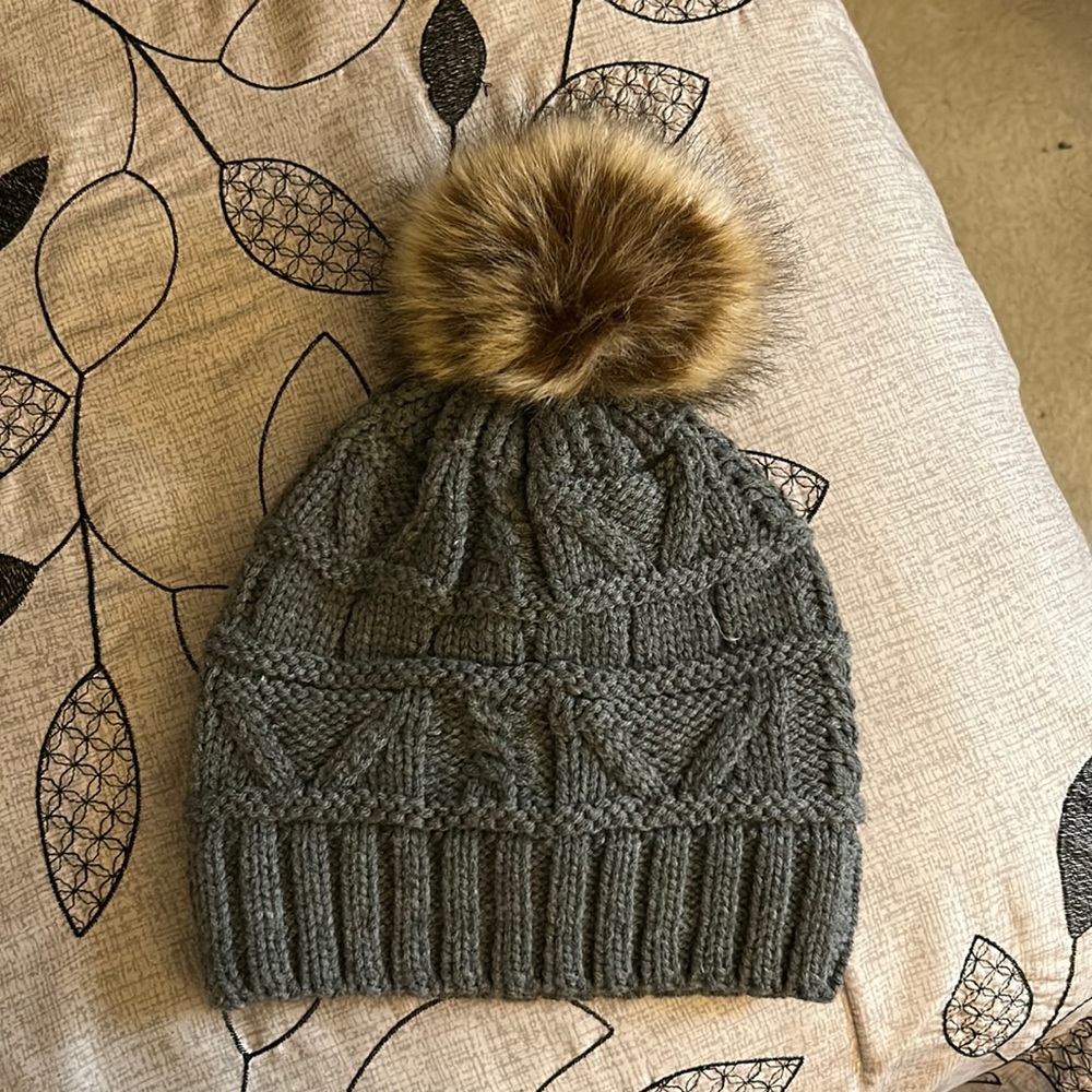 Fleece lined gray Winter hat with tan/brown fuzzy ball
